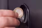 hand-inserting-coin-vending-machine